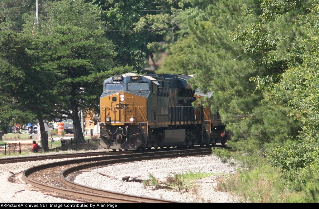 CSX 3310 and 5214 round the curve by Mayor’s park